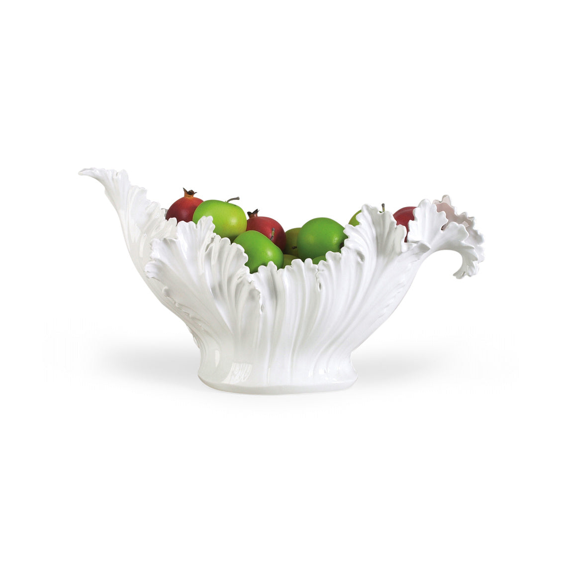 White leaf-shaped fruit bowl with apples on a white background