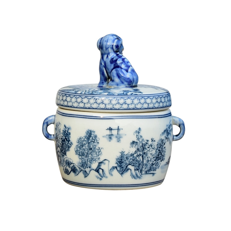 Blue and white ceramic jar with lid and handles on a white background