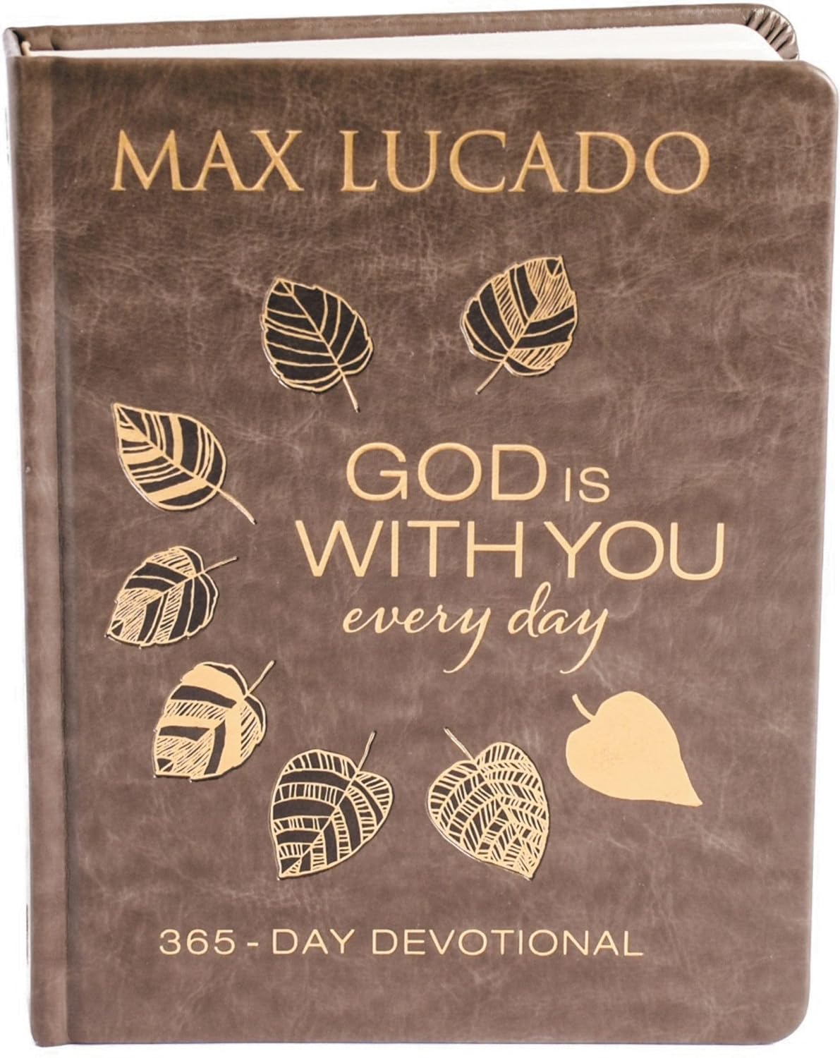 Brown devotional book with gold text and leaf illustrations, featuring Max Lucado's name and 'God is with you every day' quote.