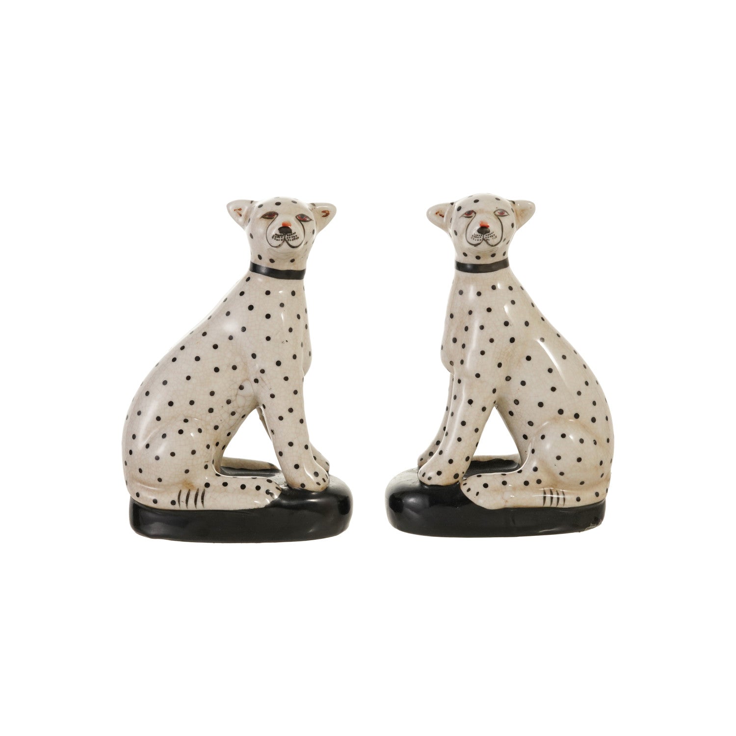 Two ceramic cheetah figurines with black spots on a white background