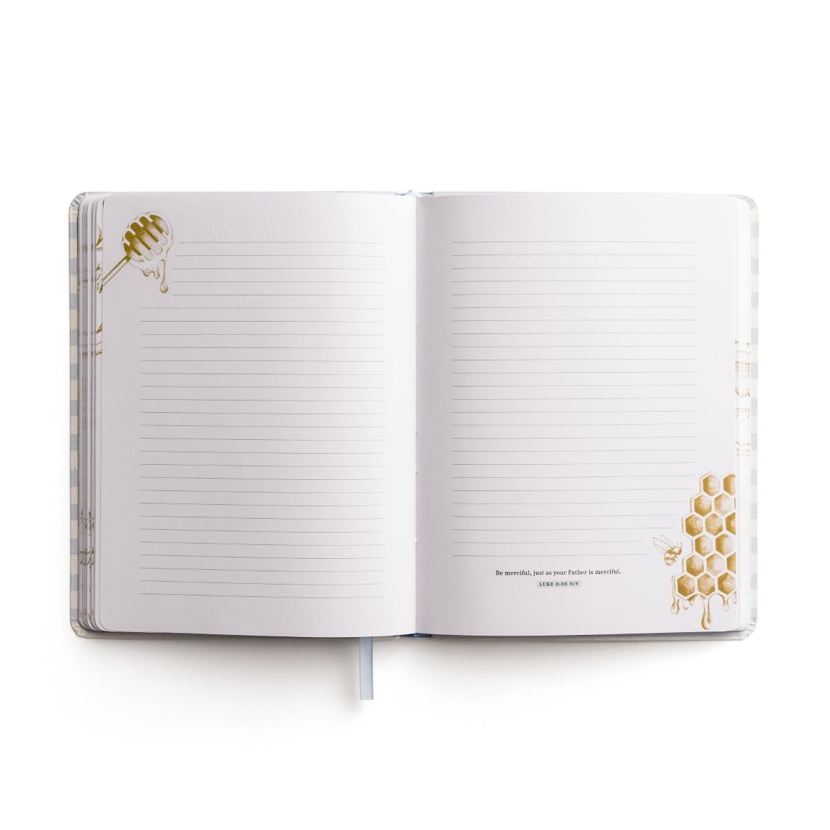 Open notebook with lined pages and decorative elements on a white background