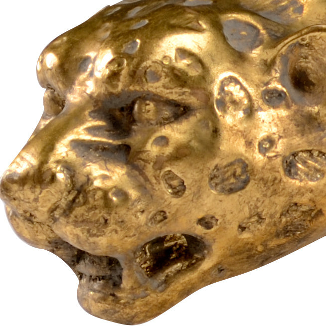 Gold leopard head sculpture on a white background