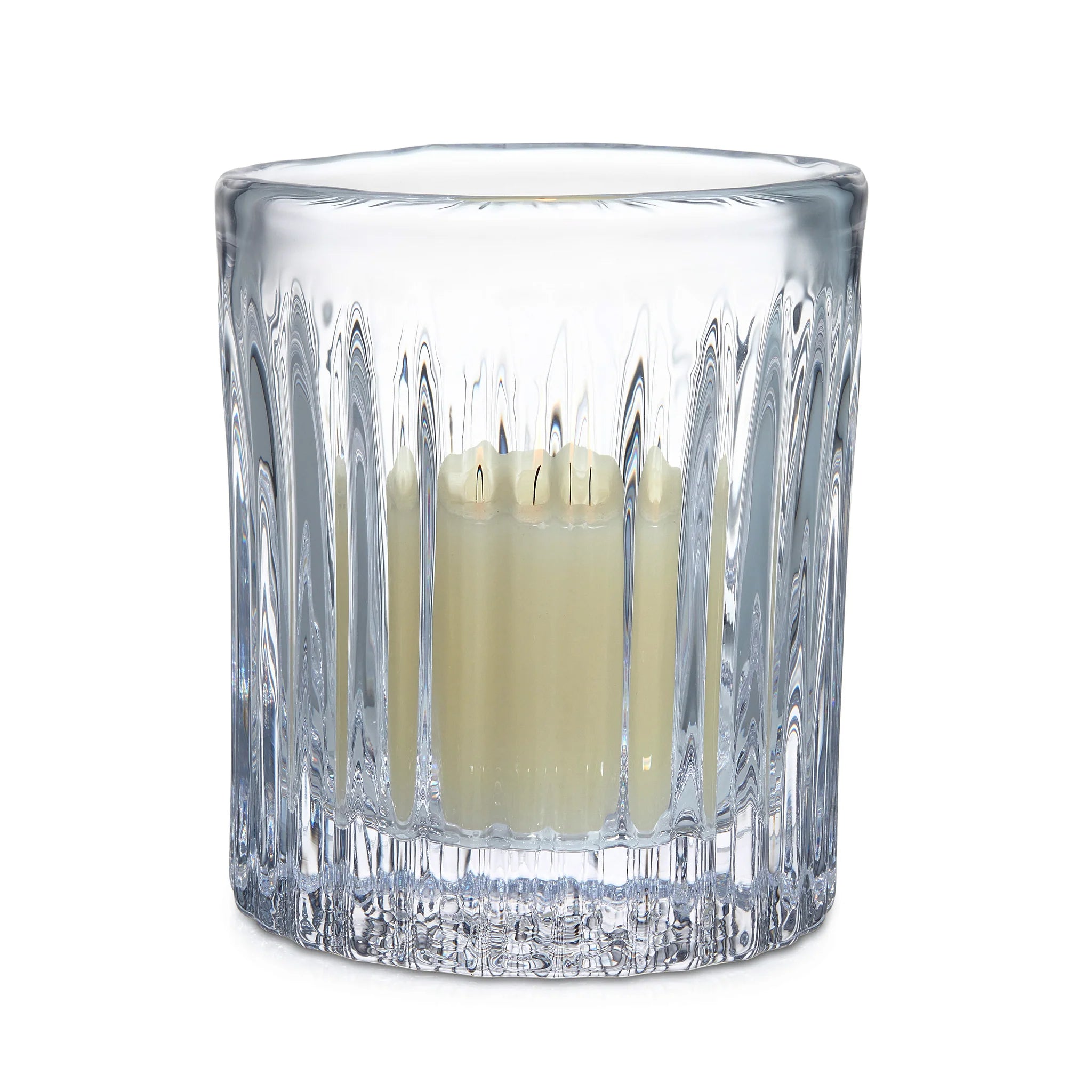 Clear glass candle holder with a candle inside on a white background