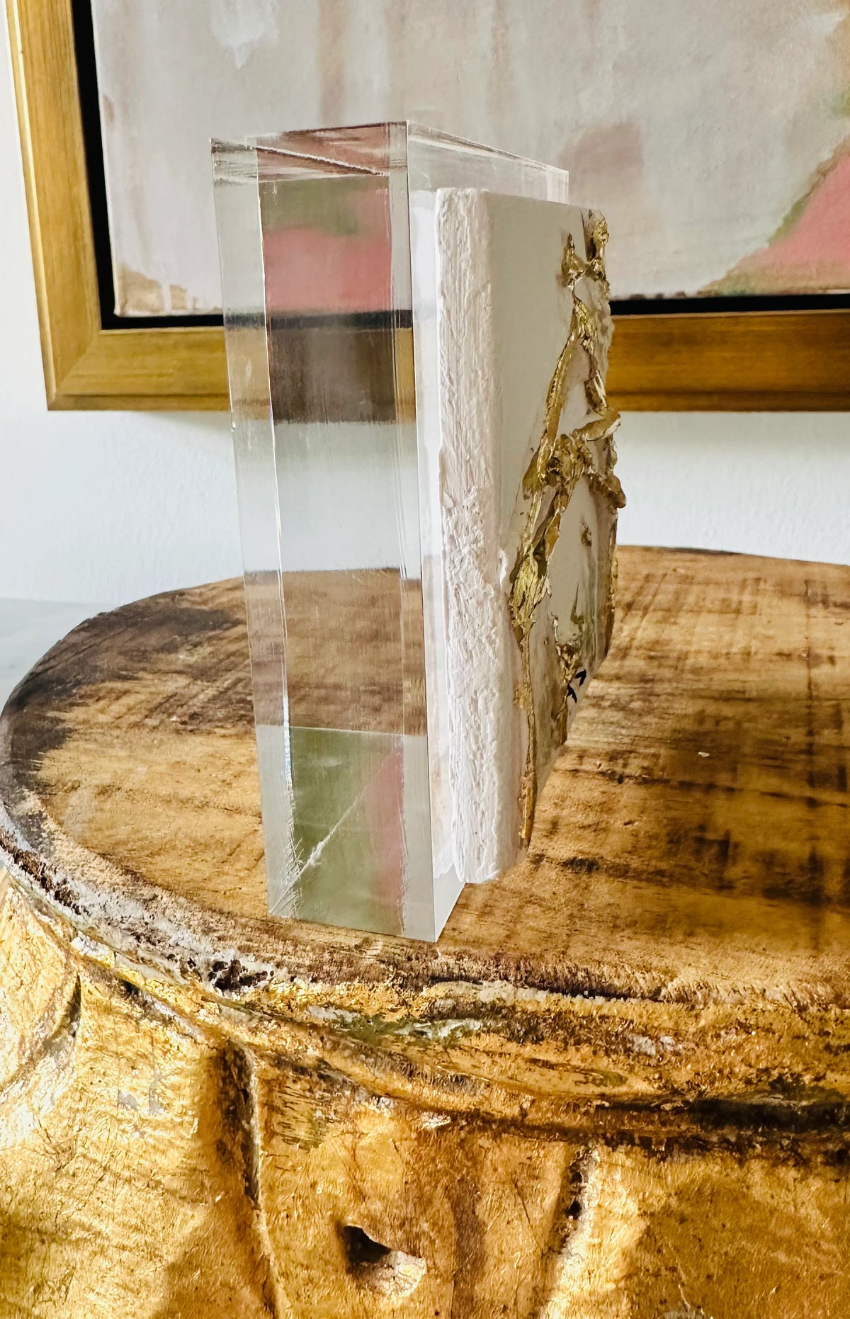 Clear acrylic block with decorative elements on a wooden surface