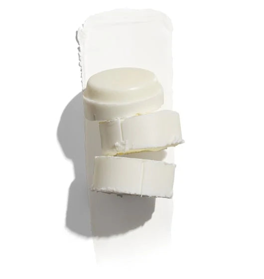 White cylindrical container with a lid on a white background