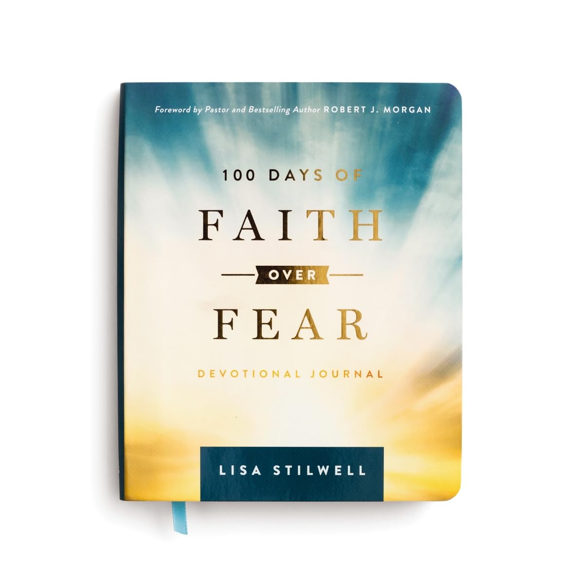 Book titled '100 Days of Faith Over Fear' by Lisa Stilwell with a blurred background