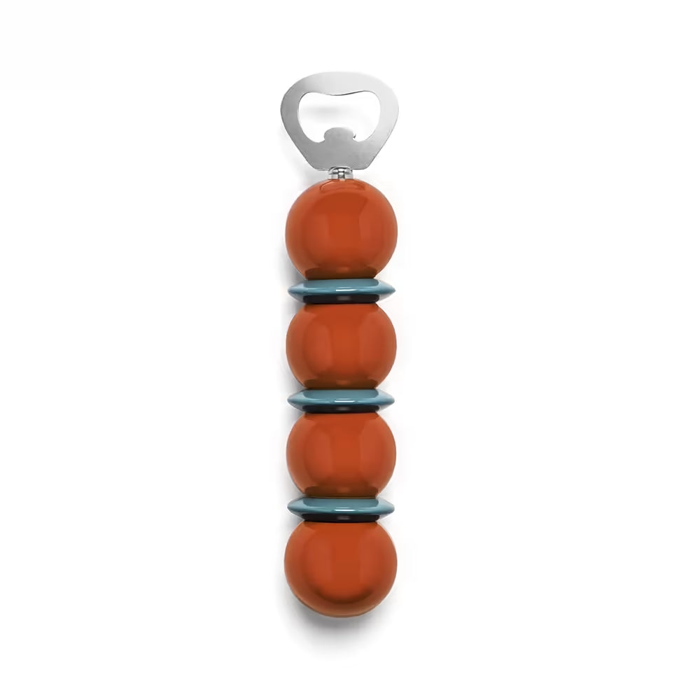 Stack of orange bottles with a silver bottle opener on a white background