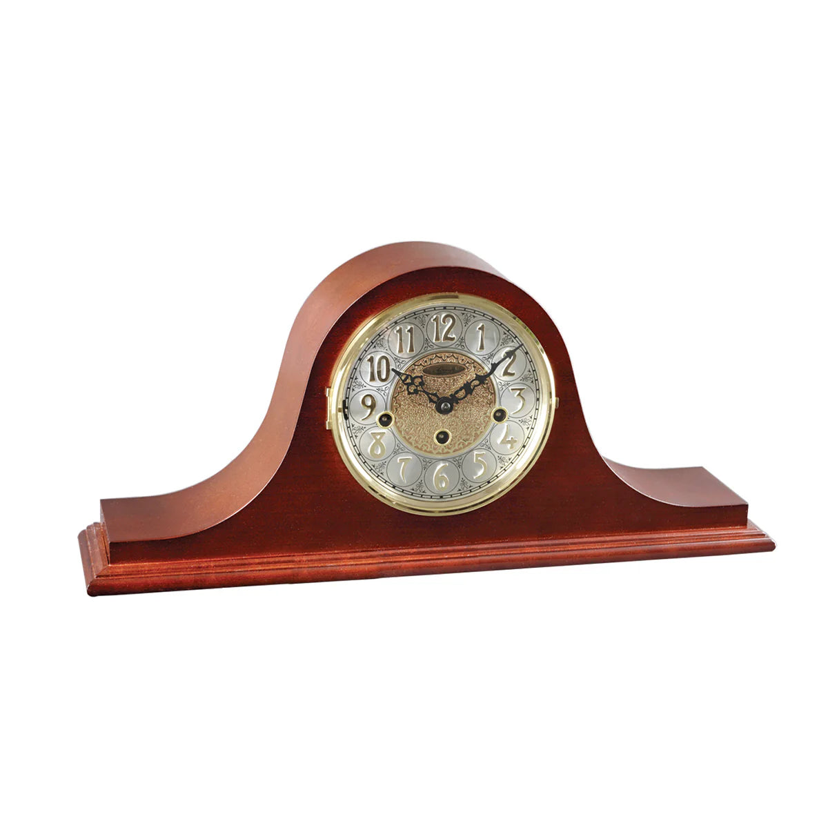 Wooden mantel clock with a white face on a white background