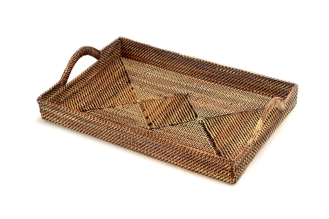 A rectangular woven tray with a single loop handle, crafted from natural brown and tan fibers, shown on a plain white background.