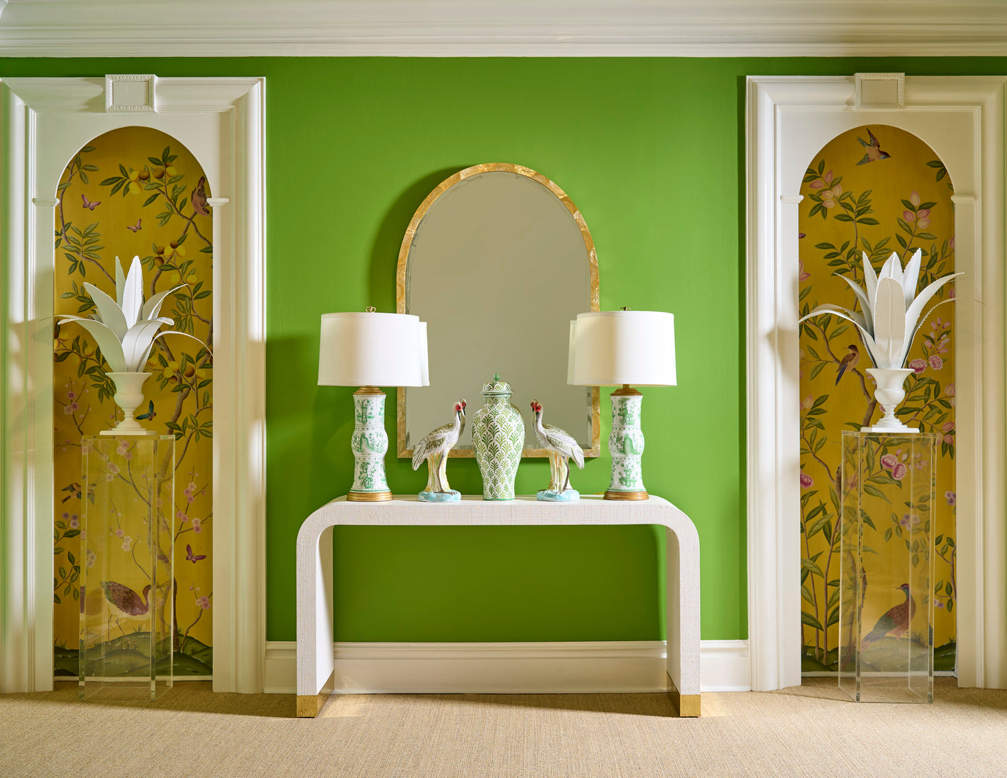 Decorative interior with a green wall, white console table, and floral-patterned doors.