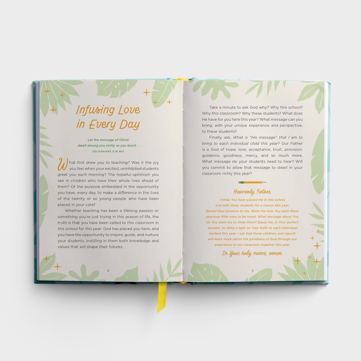 Open book with green leaf patterns on a white background