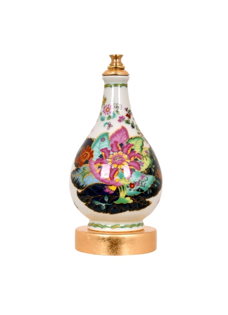 Decorative bottle with floral designs on a white background